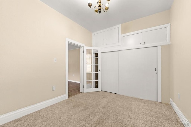 320 E Godding, Trinidad, CO 81082 - unfurnished bedroom with carpet, a chandelier, and a closet