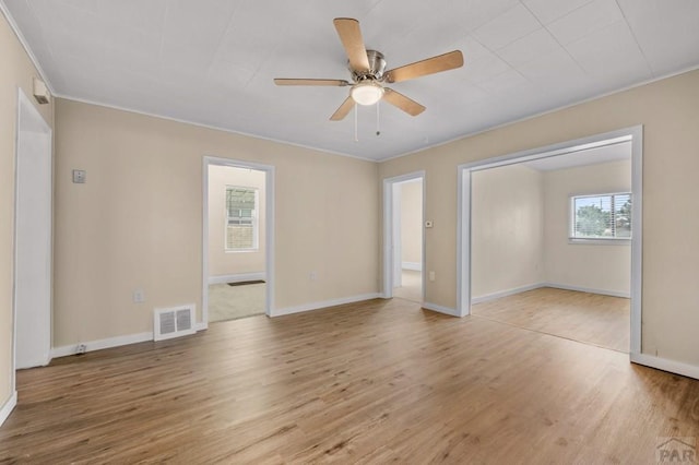 320 E Godding, Trinidad, CO 81082 - spare room featuring light wood-style flooring, ceiling fan, and crown molding