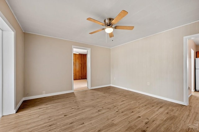 320 E Godding, Trinidad, CO 81082 - unfurnished room featuring a ceiling fan, wood finished floors, and ornamental molding