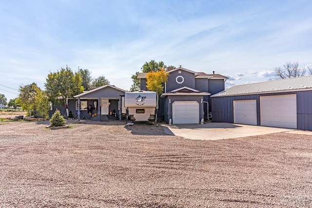 view of front of house featuring a porch and concrete driveway