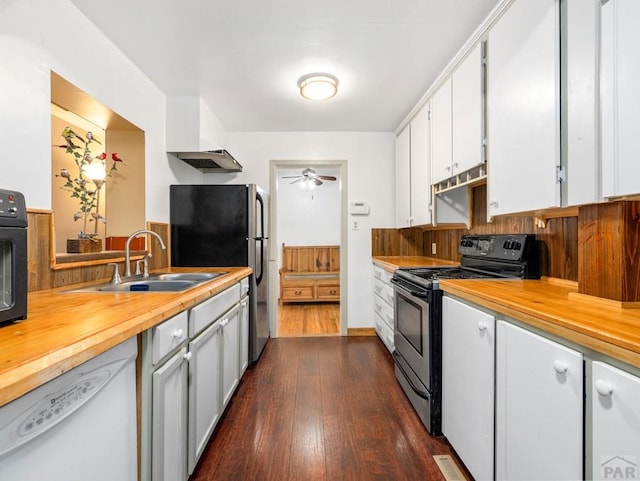 2910 8th Ave, Pueblo, CO 81008 - kitchen featuring stainless steel appliances, butcher block counters, dark wood finished floors, and a ceiling fan