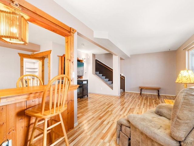 2910 8th Ave, Pueblo, CO 81008 - living area with stairs, wood finished floors, and wine cooler