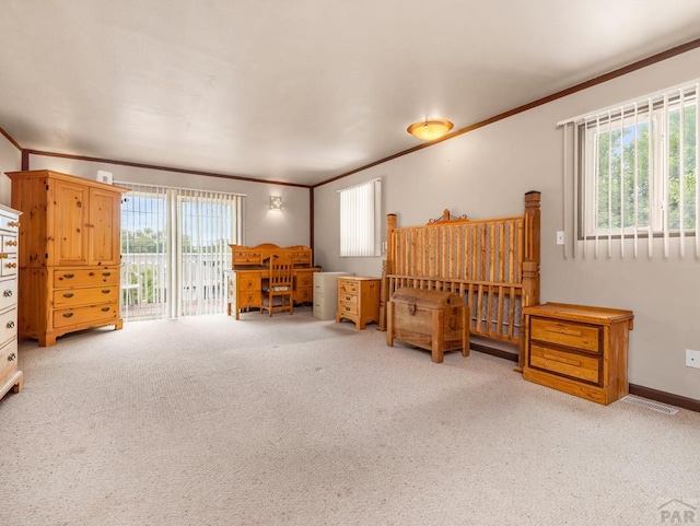 2910 8th Ave, Pueblo, CO 81008 - bedroom with crown molding, carpet, multiple windows, and access to outside