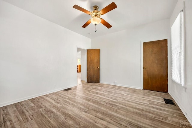2325 W St, Pueblo, CO 81003 - spare room with plenty of natural light, wood finished floors, and a ceiling fan
