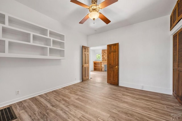 2325 W St, Pueblo, CO 81003 - spare room with wood finished floors and a ceiling fan