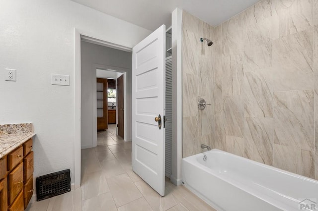 2325 W St, Pueblo, CO 81003 - full bath with vanity, tub / shower combination, and tile patterned flooring