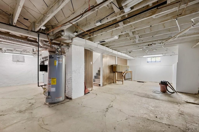 2325 W St, Pueblo, CO 81003 - basement featuring gas water heater and stairway