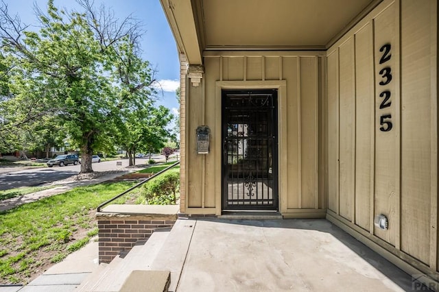 2325 W St, Pueblo, CO 81003 - property entrance with board and batten siding