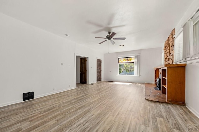 2325 W St, Pueblo, CO 81003 - unfurnished living room with ceiling fan and light wood finished floors