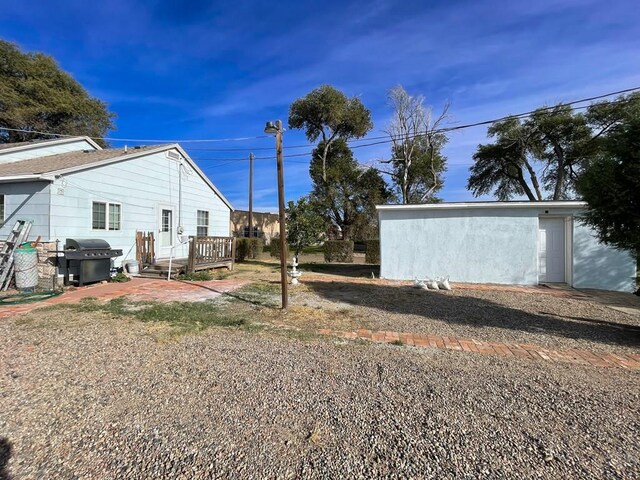 view of yard with a wooden deck