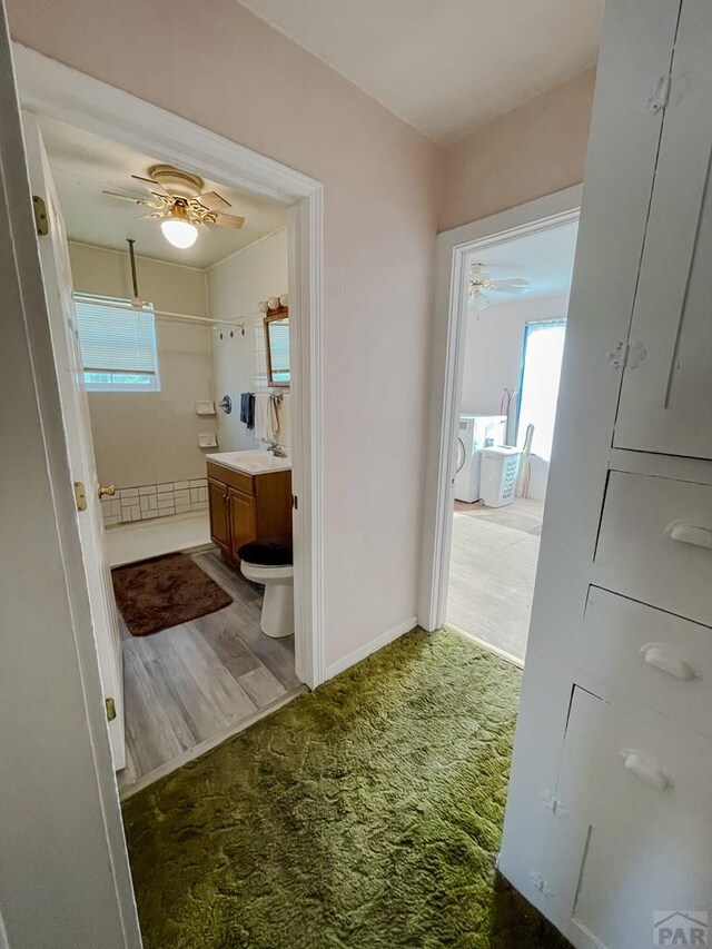 full bathroom with ceiling fan, a wealth of natural light, and vanity