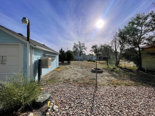 view of yard with a fire pit