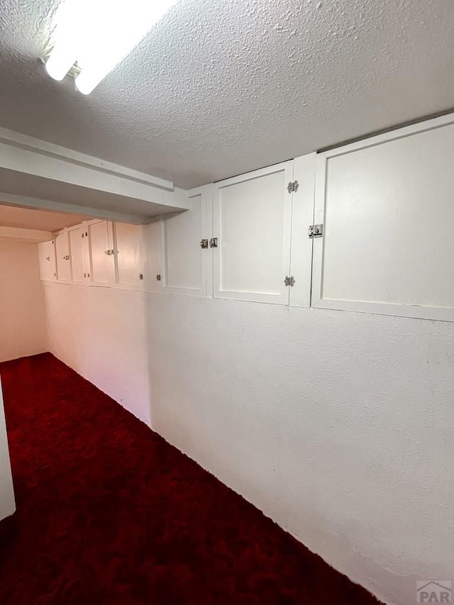 interior space featuring a textured ceiling