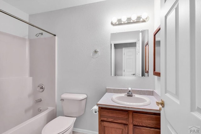 full bath featuring toilet, vanity, and shower / washtub combination