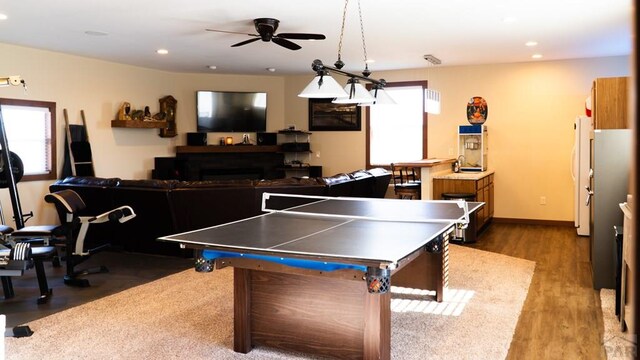 game room with ceiling fan, recessed lighting, plenty of natural light, and wood finished floors