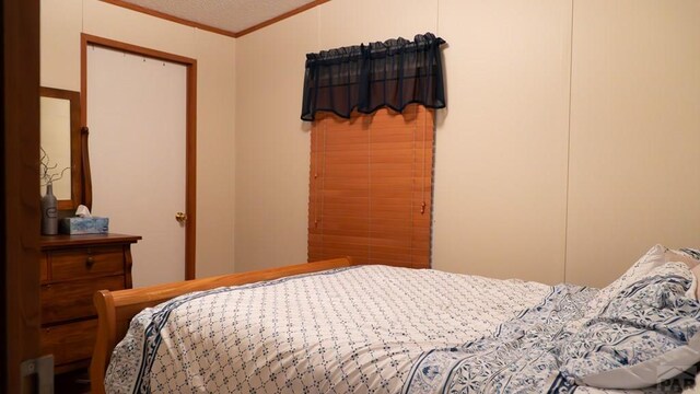 bedroom with ornamental molding