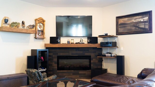 living room with a glass covered fireplace