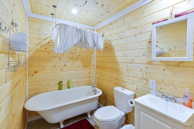 full bathroom featuring toilet, wood ceiling, wooden walls, vanity, and a freestanding tub