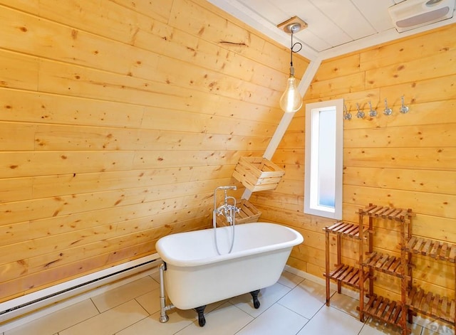 bathroom featuring lofted ceiling, wood walls, tile patterned flooring, and a freestanding bath