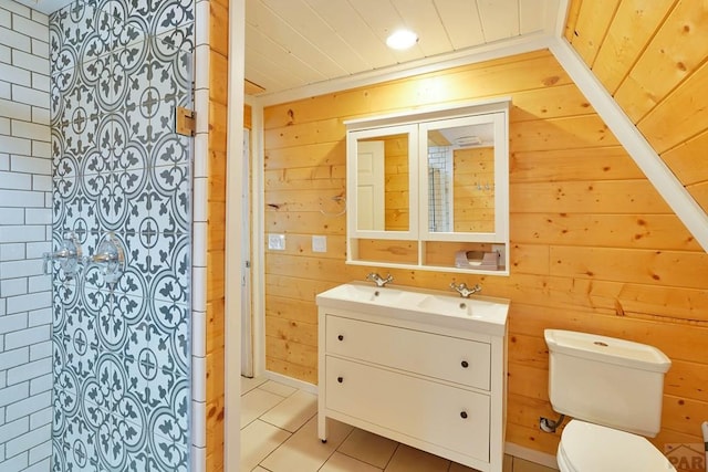 bathroom featuring toilet, wood ceiling, wood walls, vanity, and tile patterned flooring