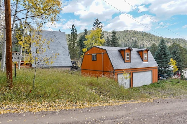 exterior space featuring a view of trees