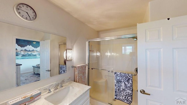 356 S Littler Dr, Pueblo West, CO 81007 - bathroom featuring vanity and a shower with door