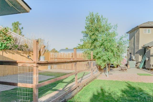356 S Littler Dr, Pueblo West, CO 81007 - view of yard with central AC and a patio area