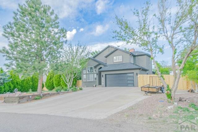 356 S Littler Dr, Pueblo West, CO 81007 - view of front of home with an attached garage and driveway