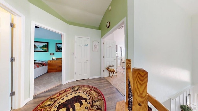 356 S Littler Dr, Pueblo West, CO 81007 - corridor with wood finished floors, baseboards, and lofted ceiling