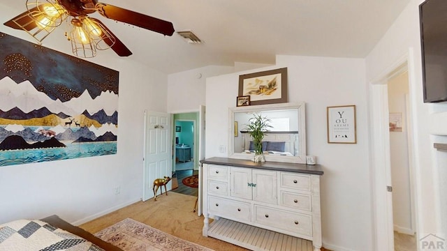 356 S Littler Dr, Pueblo West, CO 81007 - bedroom with light colored carpet, baseboards, a ceiling fan, and vaulted ceiling