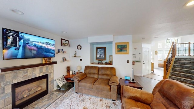 356 S Littler Dr, Pueblo West, CO 81007 - living area featuring wood finished floors, stairway, a fireplace, and recessed lighting
