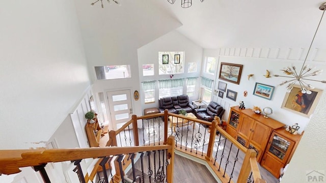 356 S Littler Dr, Pueblo West, CO 81007 - stairs with high vaulted ceiling, healthy amount of natural light, and wood finished floors