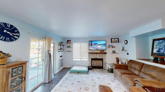 356 S Littler Dr, Pueblo West, CO 81007 - living room with wood finished floors, a fireplace, and baseboards