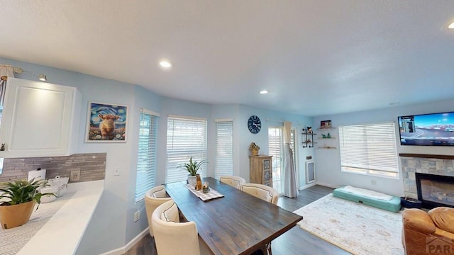 356 S Littler Dr, Pueblo West, CO 81007 - living area with baseboards, a fireplace, wood finished floors, and recessed lighting