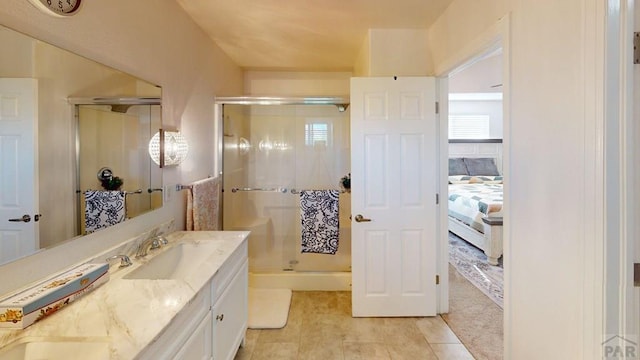 356 S Littler Dr, Pueblo West, CO 81007 - bathroom with double vanity, connected bathroom, a shower stall, and tile patterned flooring