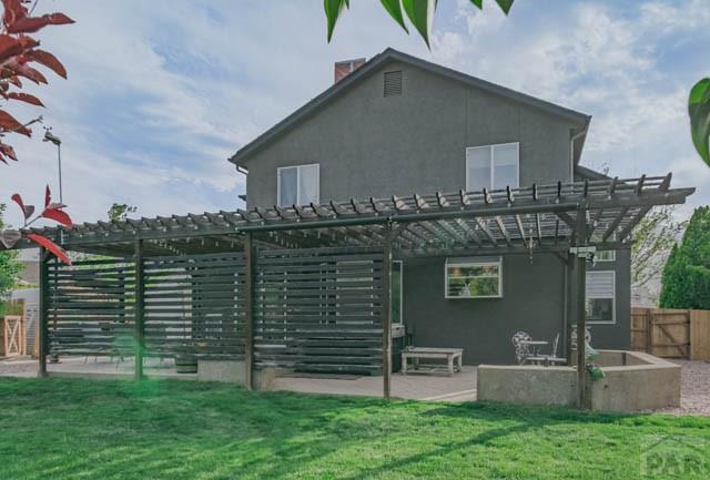 356 S Littler Dr, Pueblo West, CO 81007 - back of property featuring a pergola, a patio, and stucco siding