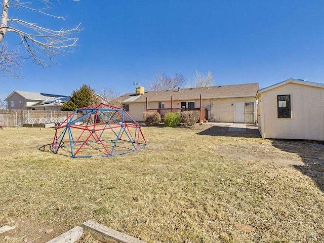 exterior space with a yard and fence