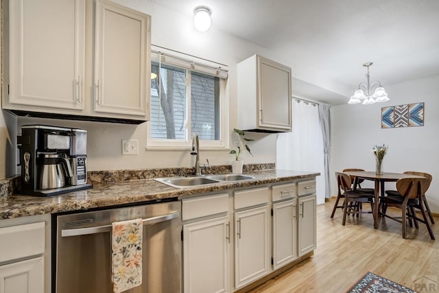 20 N 32nd St, Colorado Springs, CO 80904 - kitchen featuring stainless steel dishwasher, a sink, light wood-type flooring, a chandelier, and decorative light fixtures