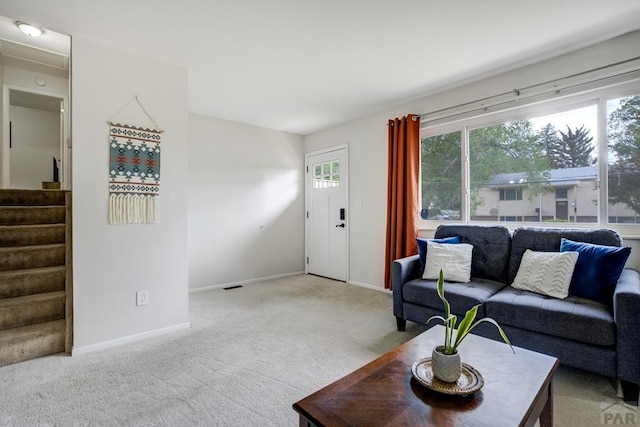20 N 32nd St, Colorado Springs, CO 80904 - living room featuring light carpet, stairs, and baseboards