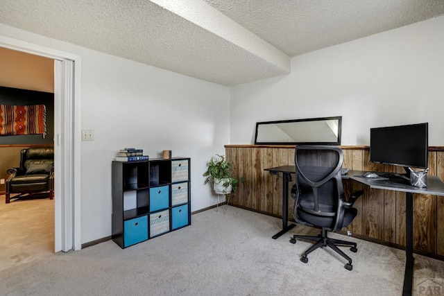 20 N 32nd St, Colorado Springs, CO 80904 - carpeted home office with a textured ceiling, wooden walls, wainscoting, and baseboards