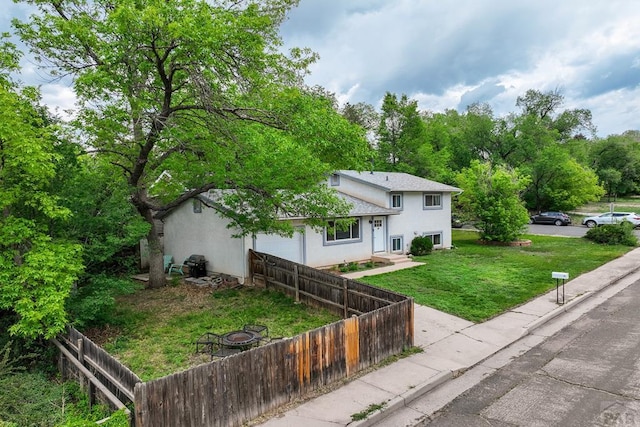 20 N 32nd St, Colorado Springs, CO 80904 - view of front of home with stucco siding and an attached garage
