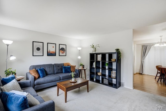 20 N 32nd St, Colorado Springs, CO 80904 - living room featuring a chandelier, carpet floors, and baseboards
