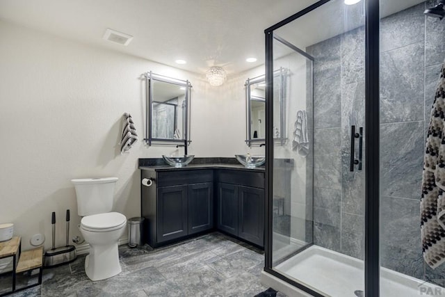 489 S Pin High Dr, Pueblo West, CO 81007 - full bath featuring a shower stall, double vanity, toilet, and recessed lighting
