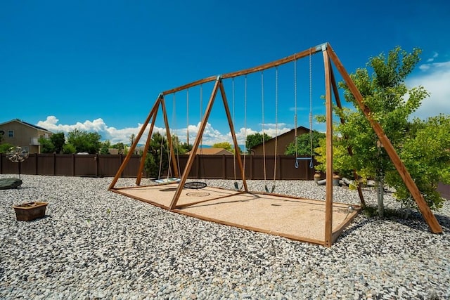 489 S Pin High Dr, Pueblo West, CO 81007 - view of play area featuring a fenced backyard and a patio area