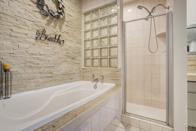 489 S Pin High Dr, Pueblo West, CO 81007 - full bath with a garden tub, a stall shower, and tile patterned floors