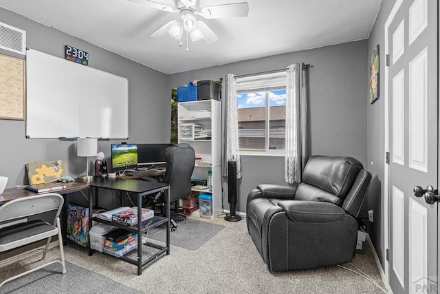 home office with a ceiling fan and carpet flooring