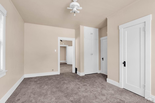 2121 N Greenwood St, Pueblo, CO 81003 - unfurnished bedroom featuring carpet flooring and crown molding