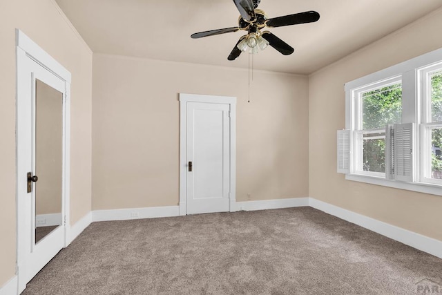 2121 N Greenwood St, Pueblo, CO 81003 - carpeted spare room with a ceiling fan and baseboards