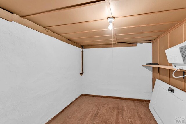2121 N Greenwood St, Pueblo, CO 81003 - below grade area with baseboards and light wood-type flooring