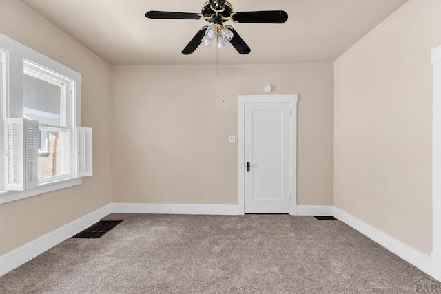 2121 N Greenwood St, Pueblo, CO 81003 - carpeted empty room featuring a ceiling fan and baseboards